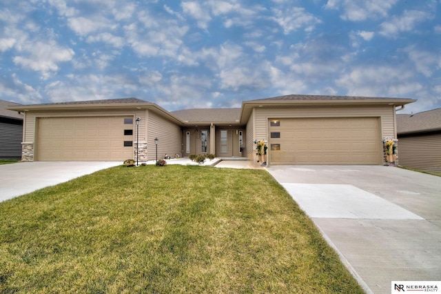 view of front facade with a front yard and a garage