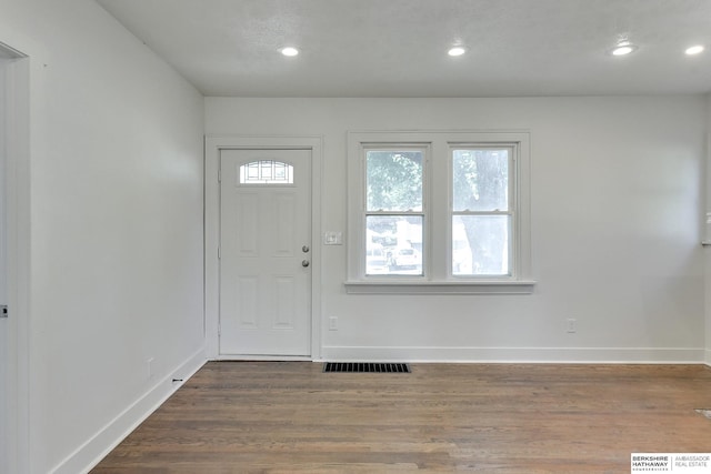 entryway with hardwood / wood-style flooring