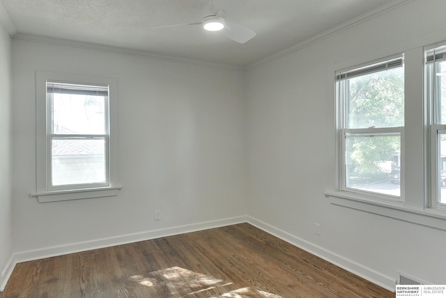 spare room with dark hardwood / wood-style flooring, ceiling fan, plenty of natural light, and ornamental molding