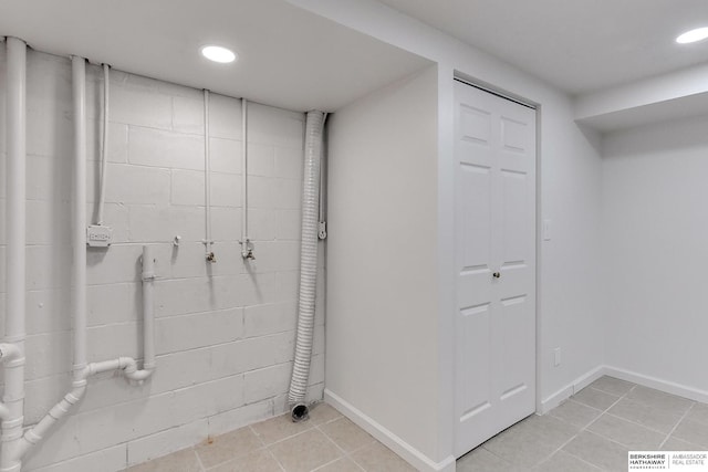 clothes washing area with light tile patterned floors and electric dryer hookup