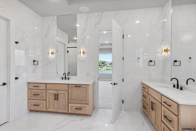 bathroom featuring vanity and tile walls