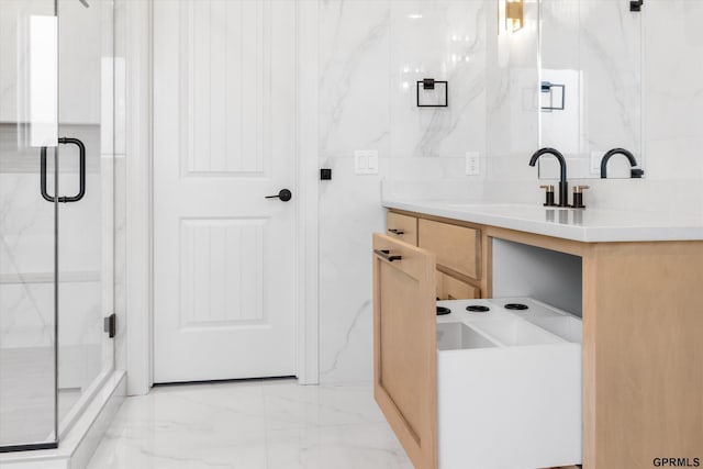 bathroom featuring tile walls, vanity, and an enclosed shower