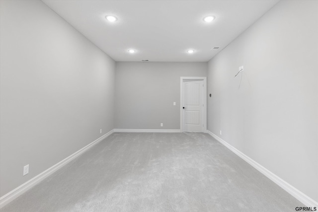 empty room featuring light colored carpet