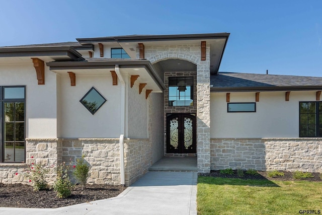 view of exterior entry featuring french doors