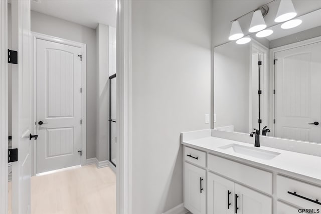 bathroom featuring hardwood / wood-style floors and vanity