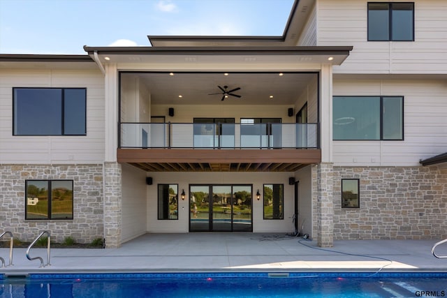 back of house featuring a patio, a balcony, and ceiling fan