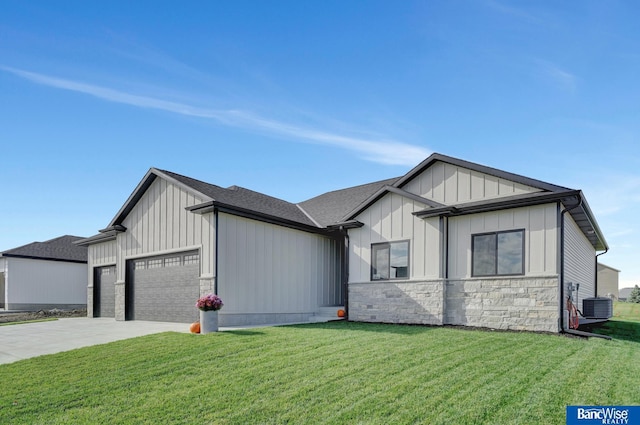 modern inspired farmhouse with a front lawn, a garage, and cooling unit