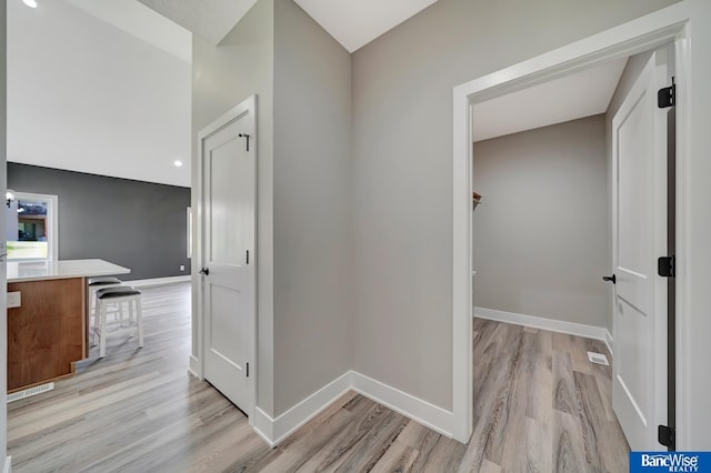 corridor featuring light hardwood / wood-style floors