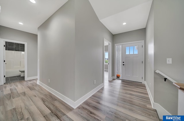 foyer entrance with light wood-type flooring