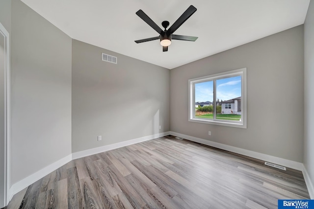 unfurnished room with light hardwood / wood-style flooring and ceiling fan