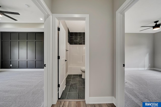 hallway featuring carpet flooring