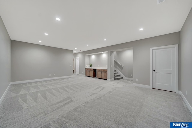 basement with light colored carpet