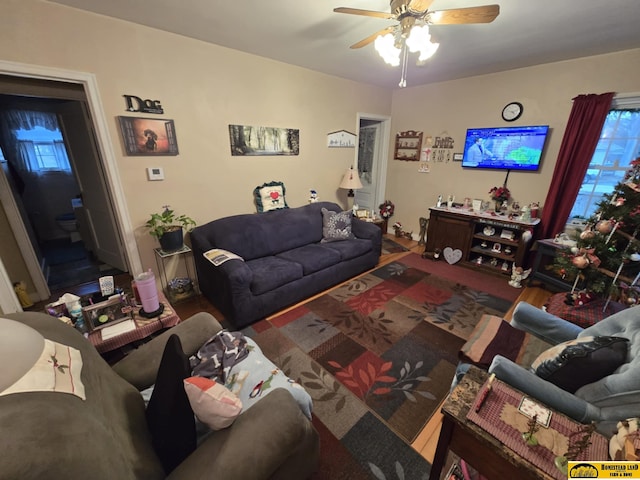 living room with hardwood / wood-style floors and ceiling fan