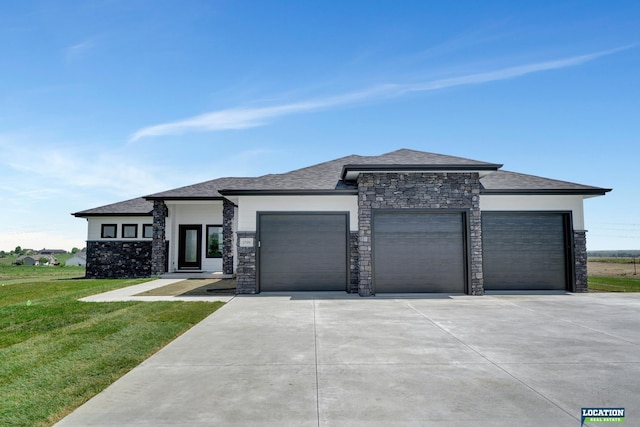 prairie-style house with a front lawn and a garage