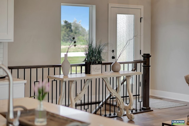 stairs featuring hardwood / wood-style flooring