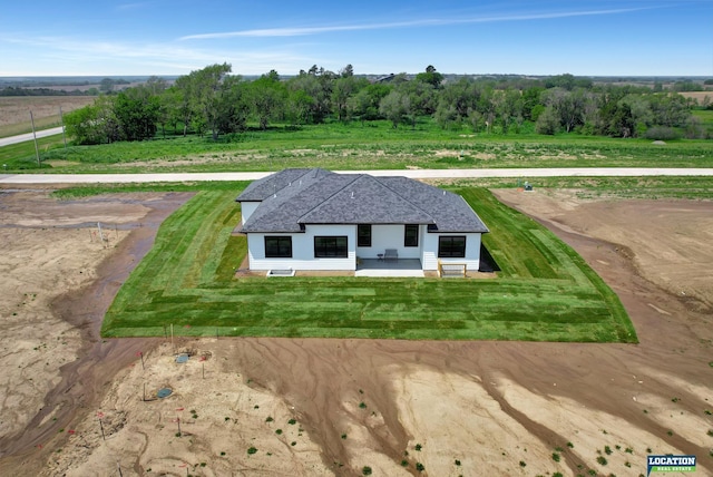 birds eye view of property featuring a rural view