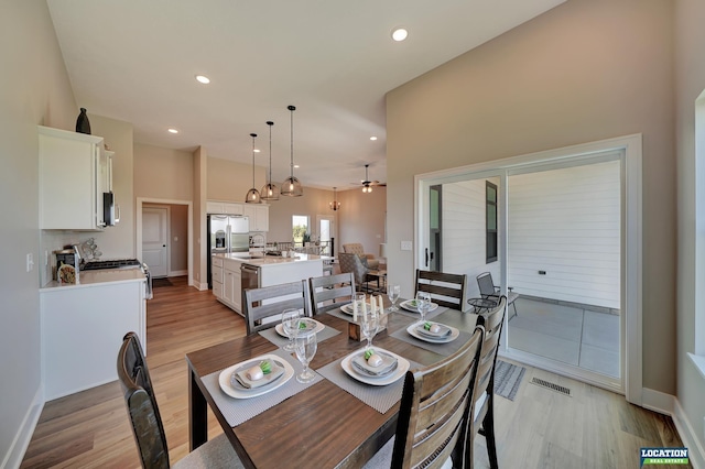 dining room featuring ceiling fan and light wood-type flooring