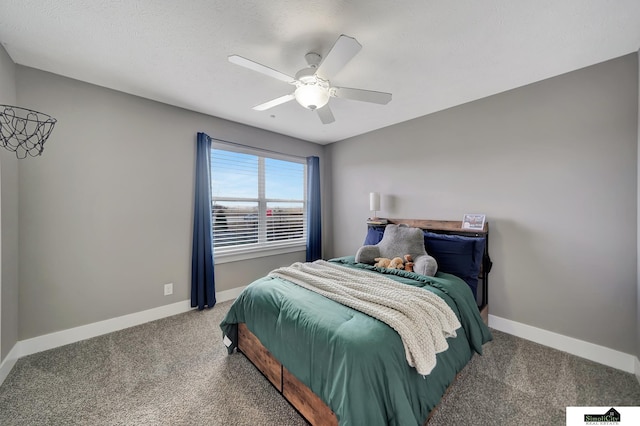 bedroom with carpet, a textured ceiling, and ceiling fan