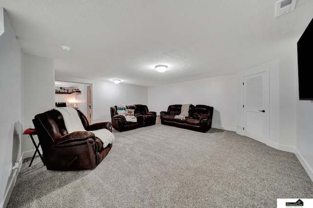 living room featuring a textured ceiling and carpet floors