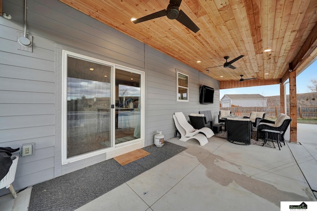 view of patio with outdoor lounge area and ceiling fan