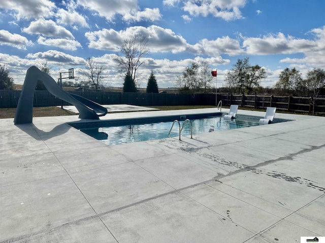 view of swimming pool featuring a water slide