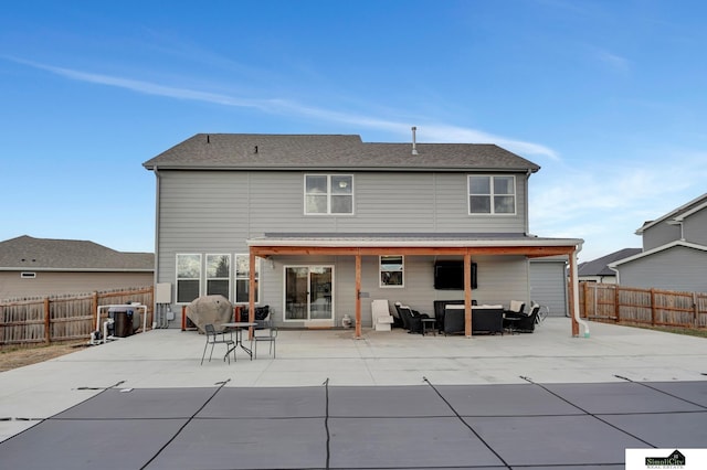 rear view of house with an outdoor hangout area and a patio area