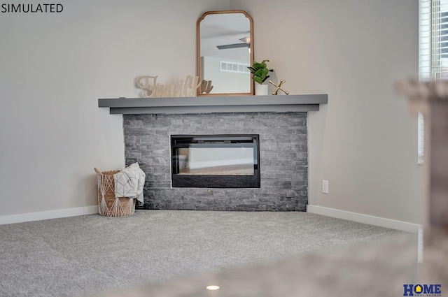 room details with a stone fireplace and carpet floors