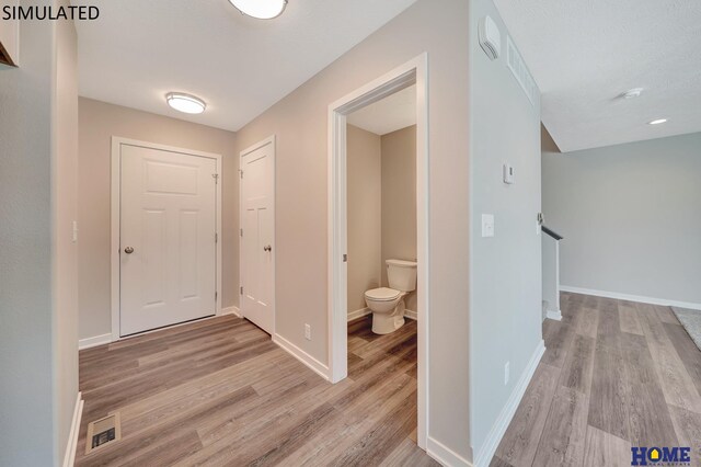 hallway featuring light hardwood / wood-style flooring