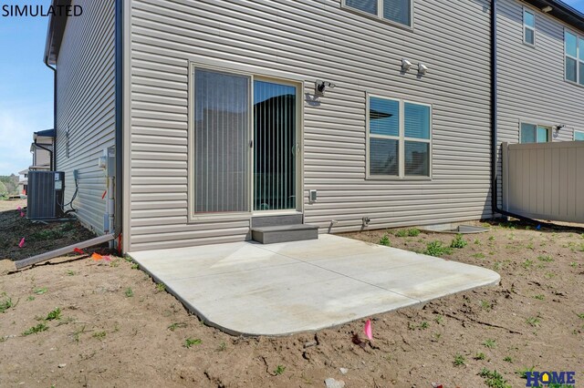 exterior space with central AC unit and a patio area