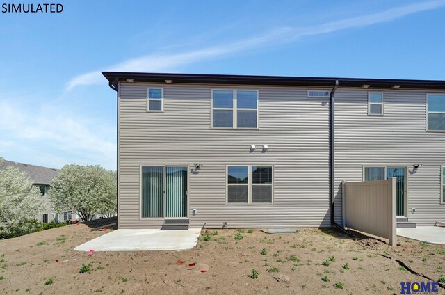 rear view of property featuring a patio area