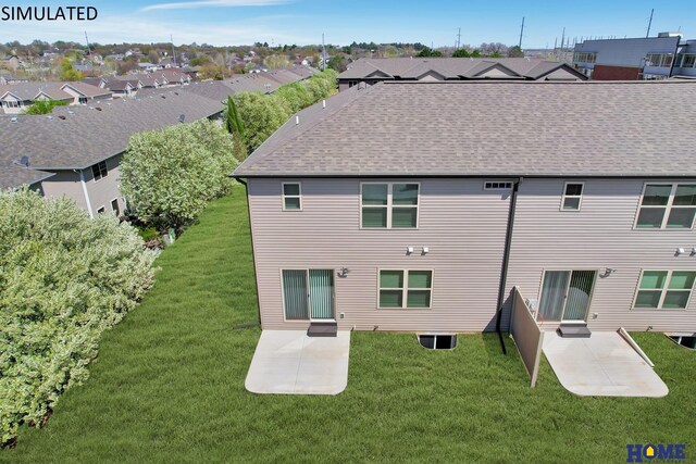 back of property with a patio area and a yard