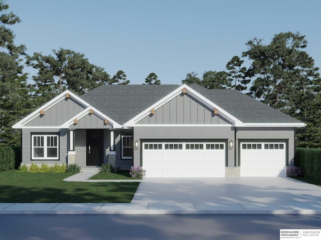 craftsman inspired home featuring a front yard and a garage