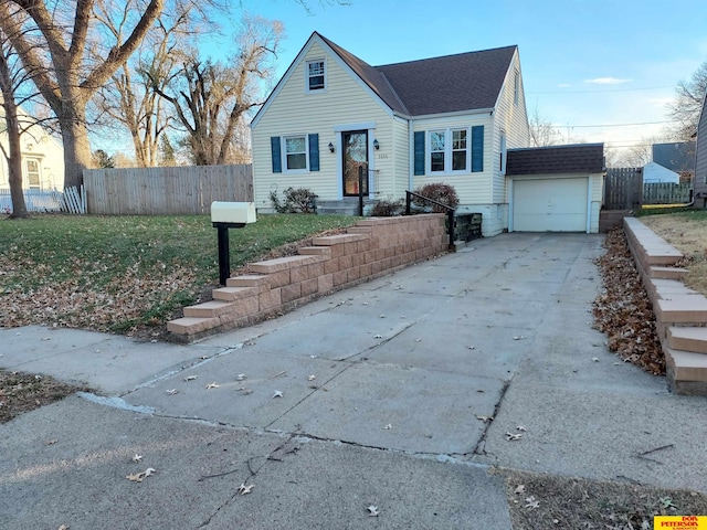 view of front of house featuring a garage and an outdoor structure