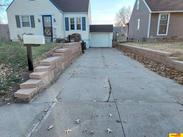 view of front of property featuring an outbuilding and a garage