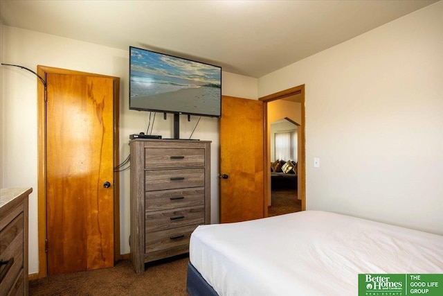 bedroom featuring dark carpet