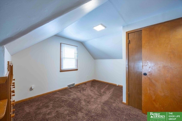 bonus room with carpet flooring and lofted ceiling