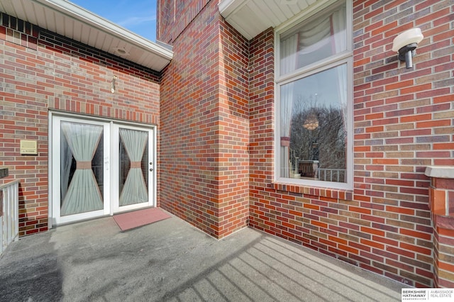 property entrance featuring french doors