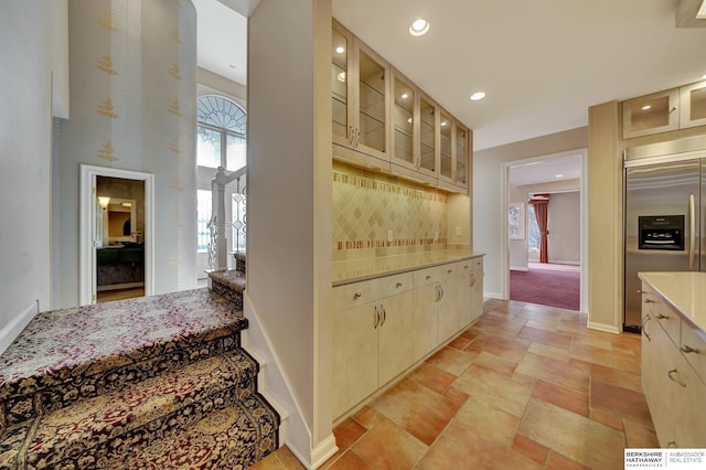 interior space featuring built in fridge and light stone countertops