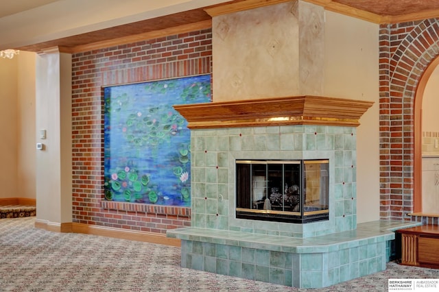 interior details featuring a fireplace and carpet