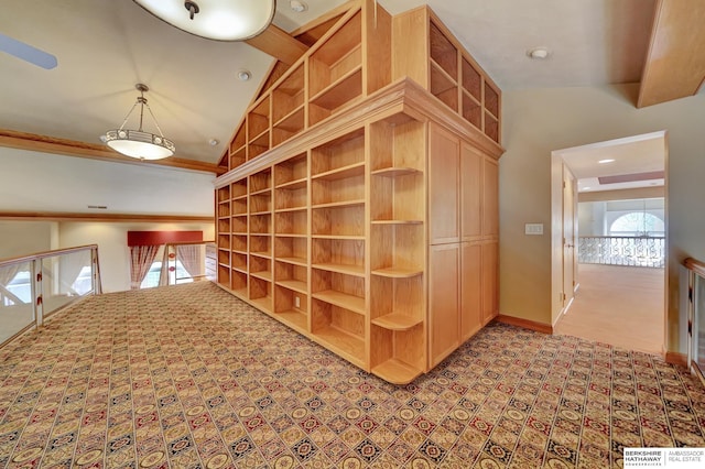 interior space featuring lofted ceiling and light carpet