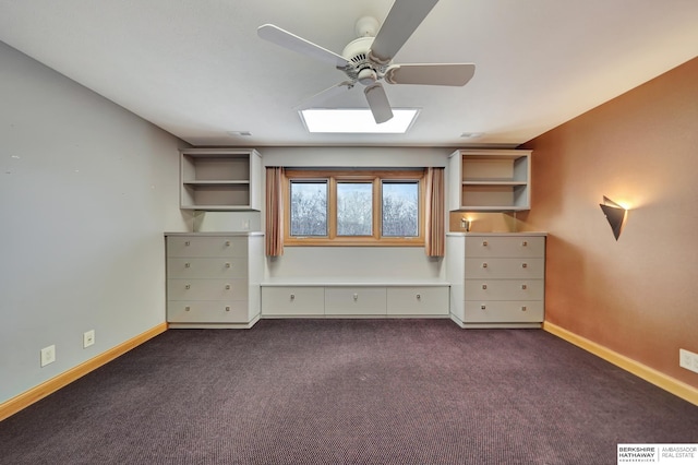 unfurnished bedroom with dark colored carpet and ceiling fan