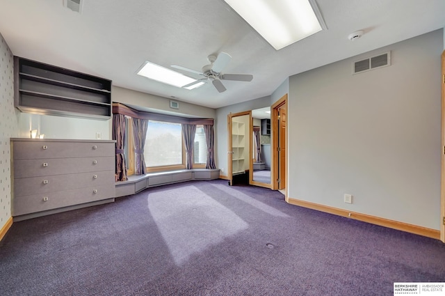 unfurnished bedroom with ceiling fan and carpet floors