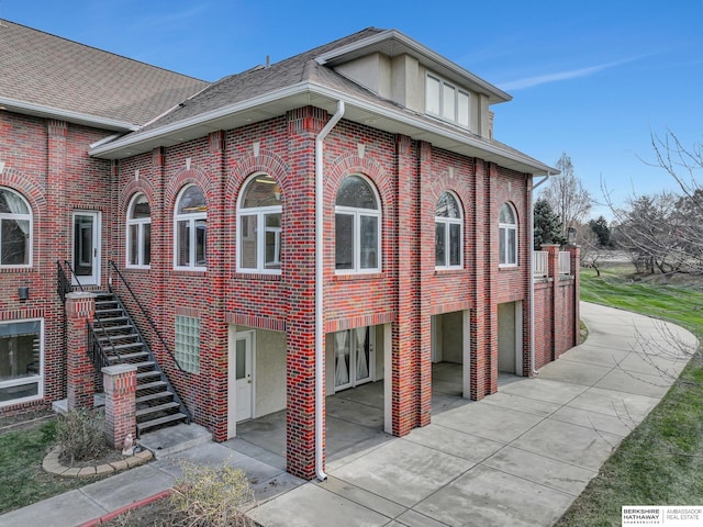 view of side of property featuring a garage