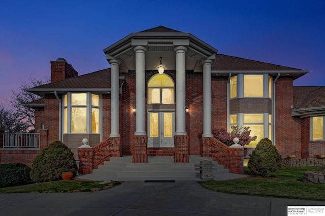 greek revival inspired property featuring french doors