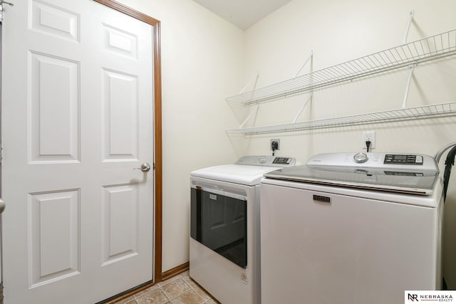 laundry room featuring washing machine and clothes dryer