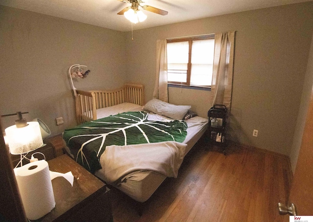 bedroom featuring hardwood / wood-style floors and ceiling fan