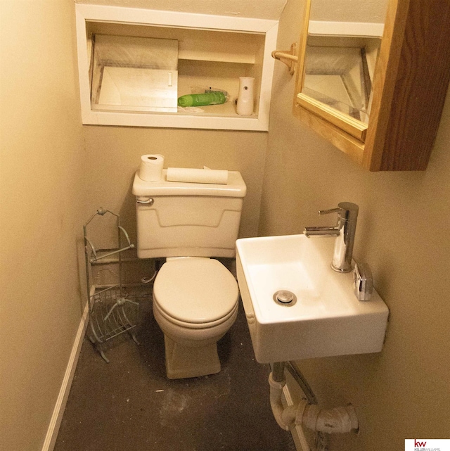 bathroom with toilet and sink