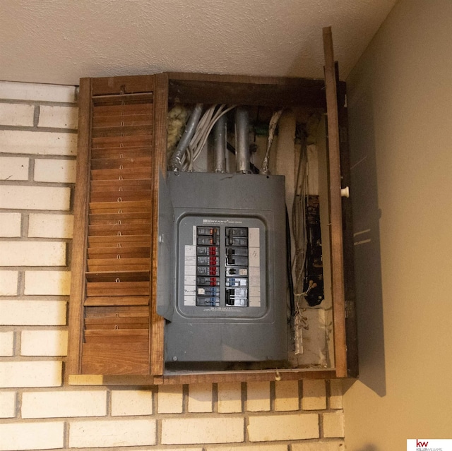 utility room featuring electric panel