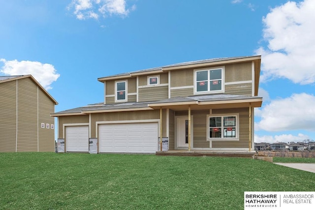 view of front facade featuring a front lawn and a garage