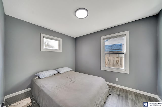 bedroom with hardwood / wood-style flooring